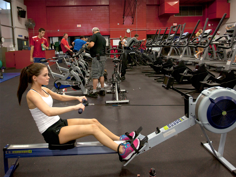 Students and community members work out at the gym.